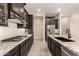 Modern kitchen featuring granite countertops, tile backsplash, and stainless steel appliances at 1933 N 140Th Ave, Goodyear, AZ 85395