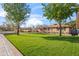 Charming single-story home with a well-maintained lawn and mature trees offering ample shade at 1940 E Montebello Ave, Phoenix, AZ 85016