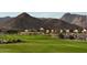 Beautiful view of golf course community with houses in the background and Arizona mountains at 20301 W Turney Ave, Buckeye, AZ 85396