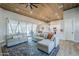 Inviting living room with a sectional sofa, and views of the kitchen and outdoor patio through large sliding doors at 2040 W Gail Rd, Queen Creek, AZ 85142