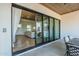Covered patio with wood ceilings and access to the backyard and living room at 2040 W Gail Rd, Queen Creek, AZ 85142