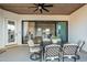 Covered patio with wood ceilings and dining set creates a welcoming outdoor living space at 2040 W Gail Rd, Queen Creek, AZ 85142
