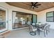 Covered patio with wood ceilings and dining set allows for outdoor entertaining at 2040 W Gail Rd, Queen Creek, AZ 85142