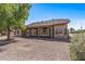 Back exterior of home, featuring a covered patio and low-maintenance yard at 20407 N Tanglewood Dr, Sun City West, AZ 85375