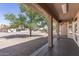 View from covered patio showcasing a well-maintained backyard and desert landscape at 20407 N Tanglewood Dr, Sun City West, AZ 85375