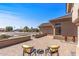 Cozy outdoor seating area showcasing pavers, a patio, and well-manicured front yard with desert landscaping at 20407 N Tanglewood Dr, Sun City West, AZ 85375