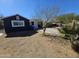 Charming single-story home featuring a xeriscaped front yard with desert-friendly landscaping at 2205 W Hadley St, Phoenix, AZ 85009