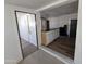 Open floor plan showing a transition from tile to hardwood and white cabinets at 2205 W Hadley St, Phoenix, AZ 85009