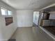 Unfurnished room with tile floors, white walls, and natural light from windows at 2205 W Hadley St, Phoenix, AZ 85009