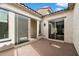 Private outdoor patio with sliding glass doors providing seamless indoor-outdoor living and natural light at 22410 N 29Th Pl, Phoenix, AZ 85050