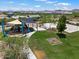 Community playground with sunshades, basketball court, and open green space at 22410 N 29Th Pl, Phoenix, AZ 85050