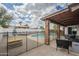 Spacious backyard with a refreshing pool, patio, and lounge area perfect for relaxation at 2254 S Noche De Paz --, Mesa, AZ 85202