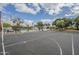 Outdoor community basketball court with waterfront views and lush landscaping under a bright, partly cloudy sky at 2254 S Noche De Paz --, Mesa, AZ 85202