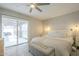 Bright bedroom featuring a sliding glass door leading to a pool and backyard at 2254 S Noche De Paz --, Mesa, AZ 85202