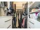 Walk-in closet featuring an organized layout, shelving and dark handles at 2254 S Noche De Paz --, Mesa, AZ 85202