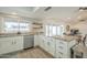 Well-lit kitchen featuring granite counters, stainless appliances, a breakfast bar, and easy access to the outdoor space at 2254 S Noche De Paz --, Mesa, AZ 85202