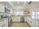Bright kitchen features granite counters, stainless appliances, and ample storage space, perfect for cooking and entertaining at 2254 S Noche De Paz --, Mesa, AZ 85202
