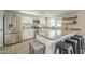 Well-equipped kitchen with granite countertops, barstool seating, and stainless steel appliances at 2254 S Noche De Paz --, Mesa, AZ 85202