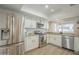 Modern kitchen with stainless steel appliances, granite countertops, and ample natural light at 2254 S Noche De Paz --, Mesa, AZ 85202