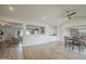 Inviting living space with wood floors and seamless transitions to the cozy living room and coffee bar at 2254 S Noche De Paz --, Mesa, AZ 85202