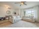 Inviting living room with a plush sectional sofa, large window, and stylish decor at 2254 S Noche De Paz --, Mesa, AZ 85202