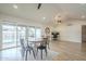 Open living space with a dining area, home office setup, and view of the outdoor pool area at 2254 S Noche De Paz --, Mesa, AZ 85202