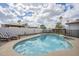A sparkling pool with lounge chairs and a covered patio offers relaxation in the backyard at 2254 S Noche De Paz --, Mesa, AZ 85202