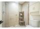 Walk-in shower with glass door, a built-in shelf and tiled walls at 2254 S Noche De Paz --, Mesa, AZ 85202