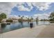 Picturesque waterfront view with lake, boats, palm trees, docks, and beautiful homes at 2254 S Noche De Paz --, Mesa, AZ 85202