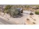 Desert home with solar panels, a three-car garage, and expansive desert landscaping at 27002 N 64Th St, Scottsdale, AZ 85266