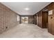 Spacious bedroom featuring a brick wall and sliding glass doors to the exterior at 27002 N 64Th St, Scottsdale, AZ 85266