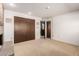 Bedroom features carpet, brick fireplace and closet at 27002 N 64Th St, Scottsdale, AZ 85266