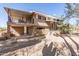 A charming two-story home featuring a spacious balcony and unique architectural details at 27002 N 64Th St, Scottsdale, AZ 85266