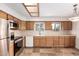 Bright and functional kitchen with stainless steel appliances and abundant cabinet storage at 27002 N 64Th St, Scottsdale, AZ 85266