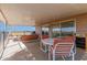 Covered patio with comfortable seating, table, and a view of the surrounding landscape at 27002 N 64Th St, Scottsdale, AZ 85266