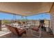 Spacious covered patio with multiple seating areas and beautiful views at 27002 N 64Th St, Scottsdale, AZ 85266