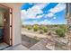 Backyard view with desert landscape and brick pathway at 29243 N 122Nd Ln, Peoria, AZ 85383