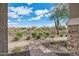 Backyard view with desert landscape and brick pathway at 29243 N 122Nd Ln, Peoria, AZ 85383
