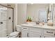 Clean bathroom features white cabinets, sink, and a glass shower with dark trim at 29243 N 122Nd Ln, Peoria, AZ 85383