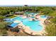 Aerial view showcasing the expansive community pool with multiple swimming areas and amenities at 29243 N 122Nd Ln, Peoria, AZ 85383