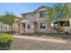 Charming two-story home with stone accents, landscaped front yard, and covered porch at 29243 N 122Nd Ln, Peoria, AZ 85383