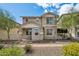 Attractive two-story home with stone and siding accents, well-manicured landscaping, and sunny curb appeal at 29243 N 122Nd Ln, Peoria, AZ 85383