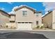 Two-story home featuring a two car garage, neutral stucco, and well-maintained landscaping at 29243 N 122Nd Ln, Peoria, AZ 85383
