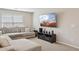 Comfortable living room with plush sectional sofa and media center for entertainment at 29243 N 122Nd Ln, Peoria, AZ 85383