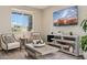 Cozy living area features a bright window with a TV at 29243 N 122Nd Ln, Peoria, AZ 85383