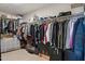 Large walk-in closet with ample storage space for clothing, shoes, and accessories at 29243 N 122Nd Ln, Peoria, AZ 85383