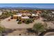 Desert home with multiple garages and terracotta roof surrounded by desert landscaping and mountain views at 31912 N 141St St, Scottsdale, AZ 85262