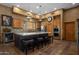 Gourmet kitchen with stainless appliances, granite island with seating, and custom cabinetry at 31912 N 141St St, Scottsdale, AZ 85262