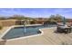 Luxury pool and patio with fountain feature, umbrellas, and lush landscaping at 31912 N 141St St, Scottsdale, AZ 85262
