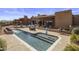 Inviting outdoor pool and patio area perfect for relaxing and entertaining with desert landscaping and blue skies at 31912 N 141St St, Scottsdale, AZ 85262